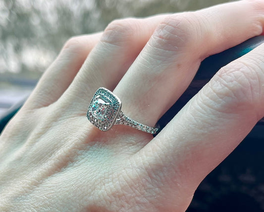 Platinum Cushion cut halo design ring.